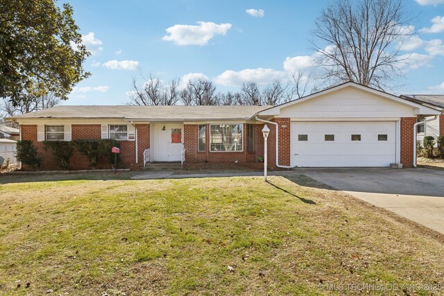 ranch-style house featuring a garage and a front lawn