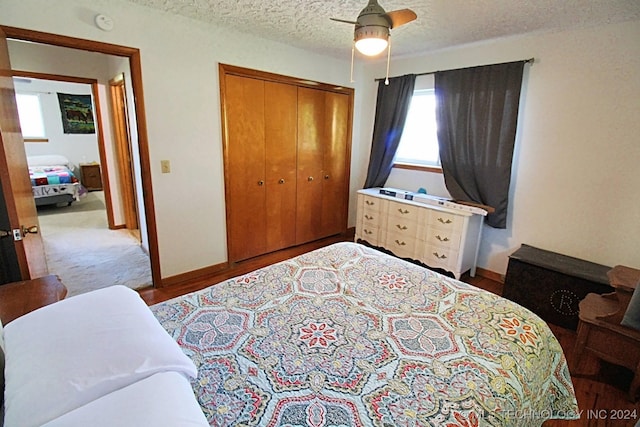 bedroom featuring a textured ceiling, a closet, and ceiling fan