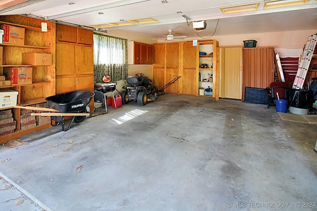 garage featuring a garage door opener and ceiling fan