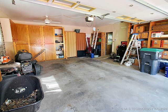 garage featuring ceiling fan and a garage door opener