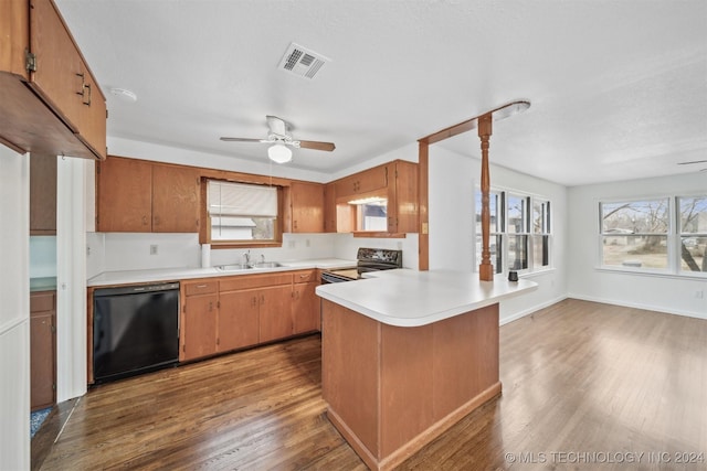 kitchen with dishwasher, sink, light hardwood / wood-style flooring, electric range, and kitchen peninsula