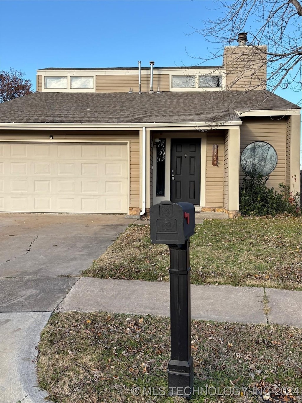 view of front of property with a garage