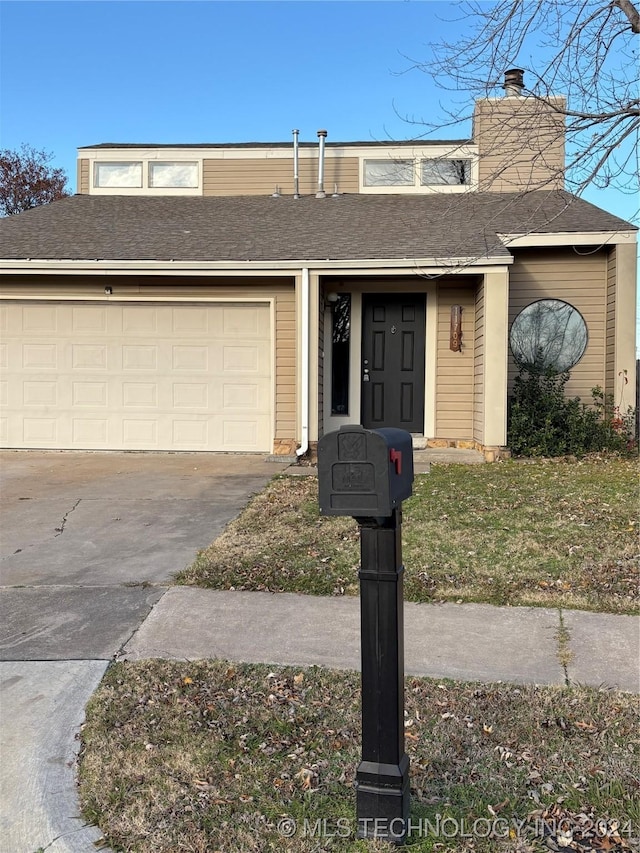 view of front of property with a garage