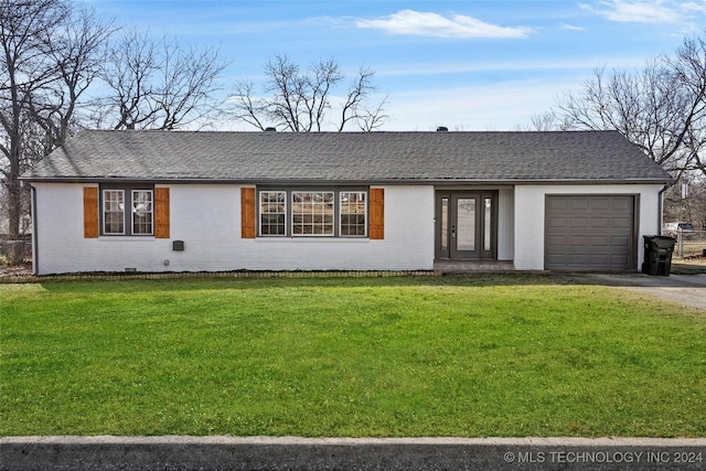 ranch-style house with a front yard and a garage