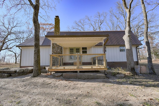 back of house with a wooden deck