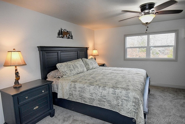 bedroom featuring ceiling fan and light carpet