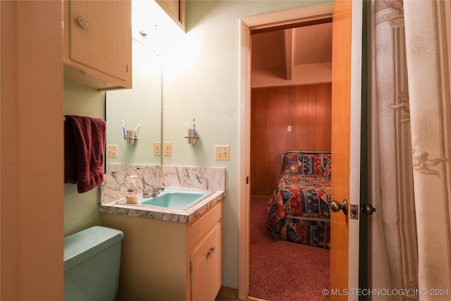 bathroom featuring vanity and toilet