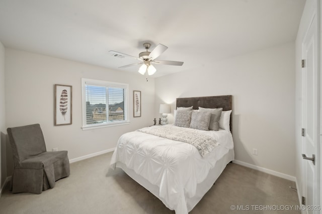 carpeted bedroom featuring ceiling fan and baseboards