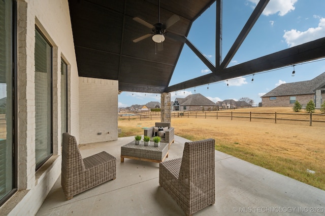 view of patio featuring a fenced backyard, an outdoor hangout area, and a ceiling fan