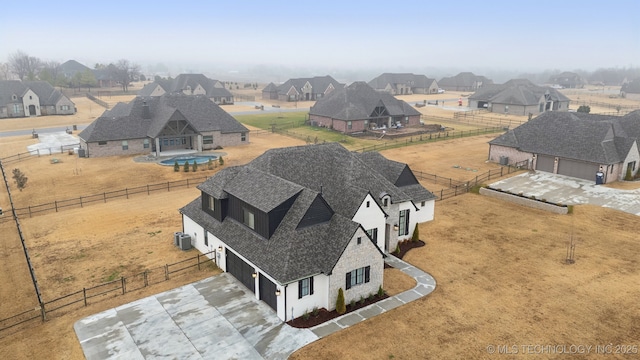 back of house with a patio area, a shingled roof, fence, and a yard