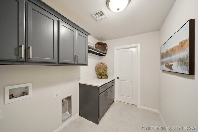 laundry room featuring washer hookup, cabinet space, visible vents, hookup for an electric dryer, and baseboards