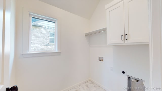 laundry room featuring electric dryer hookup, cabinets, and hookup for a washing machine