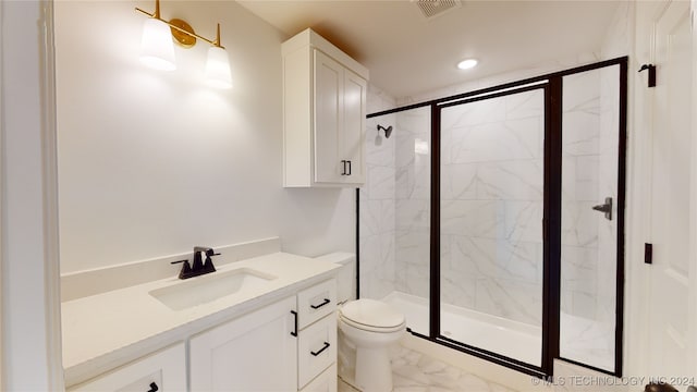 bathroom featuring vanity, an enclosed shower, and toilet