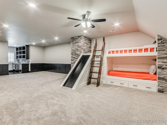 carpeted bedroom featuring ceiling fan and lofted ceiling