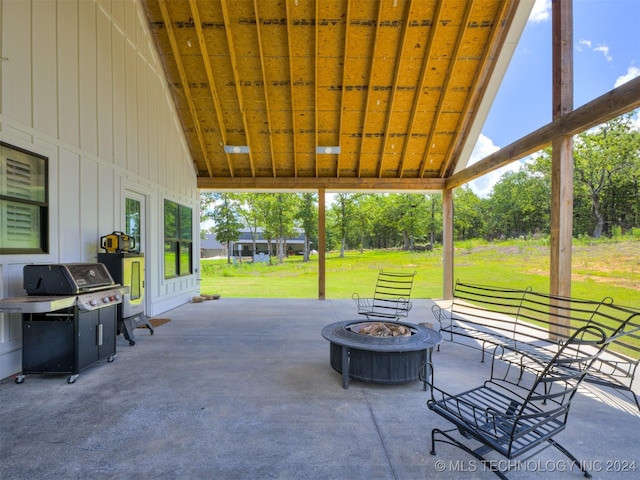 view of patio / terrace featuring a grill and an outdoor fire pit