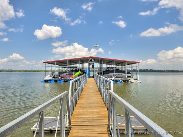 dock area featuring a water view