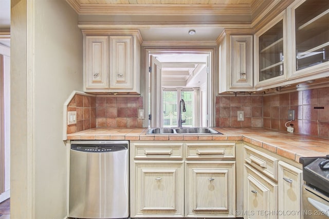 kitchen with backsplash, stainless steel appliances, and tile countertops