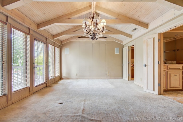 unfurnished living room with light carpet, french doors, vaulted ceiling with beams, and a notable chandelier