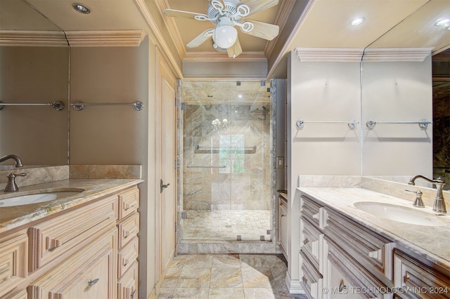 bathroom with vanity, a shower with shower door, ornamental molding, and ceiling fan