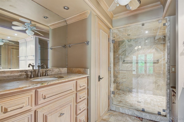 bathroom with ceiling fan, a shower with door, vanity, and ornamental molding