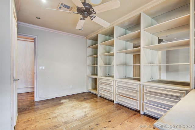 unfurnished bedroom with ceiling fan, light wood-type flooring, and ornamental molding