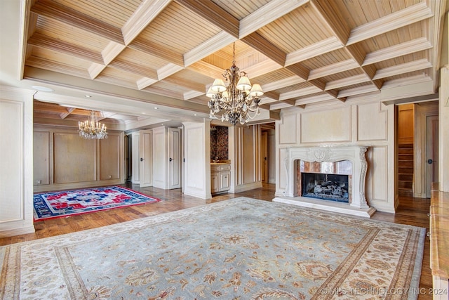 unfurnished living room featuring wood ceiling, a fireplace, wood-type flooring, and ornamental molding