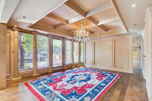 interior space featuring beamed ceiling, a notable chandelier, coffered ceiling, and wood ceiling