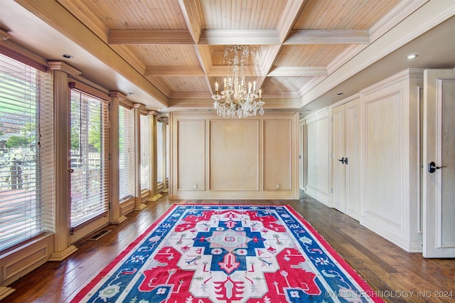 interior space featuring a chandelier, beamed ceiling, wood ceiling, and coffered ceiling