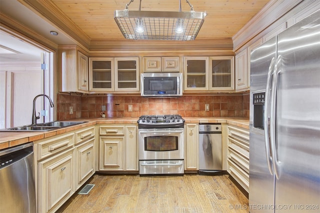 kitchen featuring tile countertops, sink, wooden ceiling, and stainless steel appliances