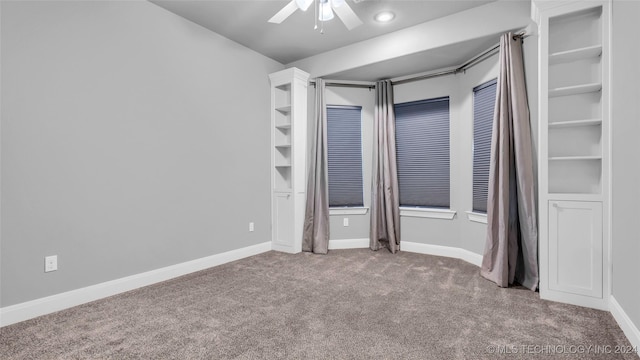 unfurnished bedroom with light colored carpet and ceiling fan