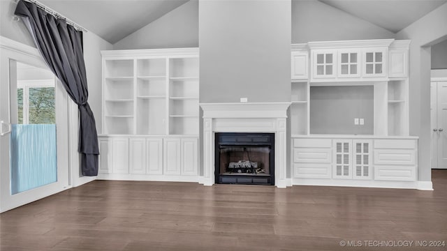 unfurnished living room with dark hardwood / wood-style floors and lofted ceiling