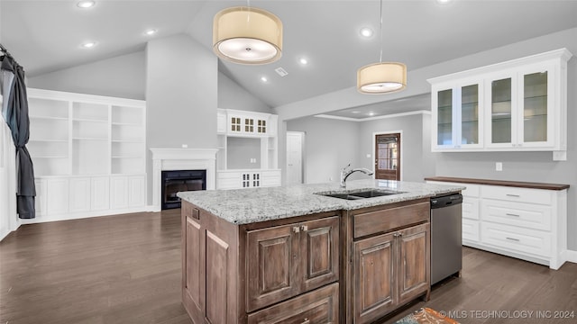 kitchen featuring built in shelves, dishwasher, sink, dark hardwood / wood-style floors, and an island with sink