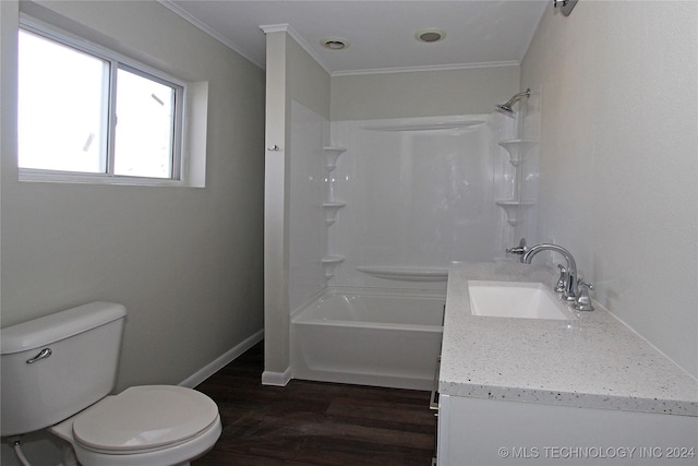 full bathroom featuring vanity, shower / washtub combination, crown molding, hardwood / wood-style flooring, and toilet