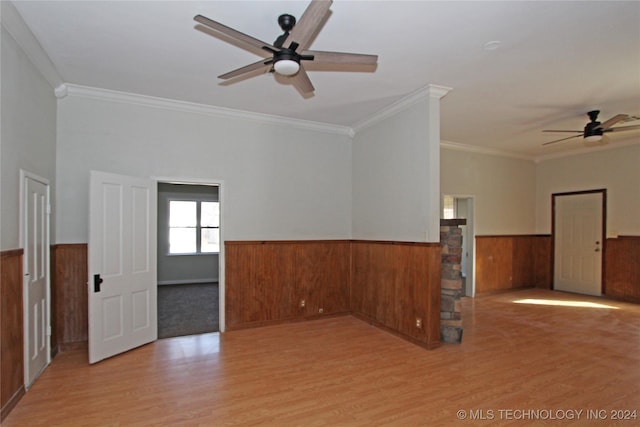 empty room featuring ceiling fan, ornamental molding, and light hardwood / wood-style flooring