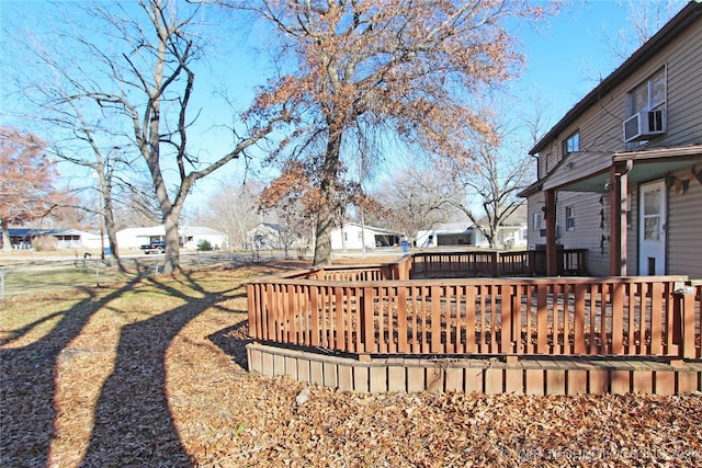 view of yard featuring cooling unit and a wooden deck