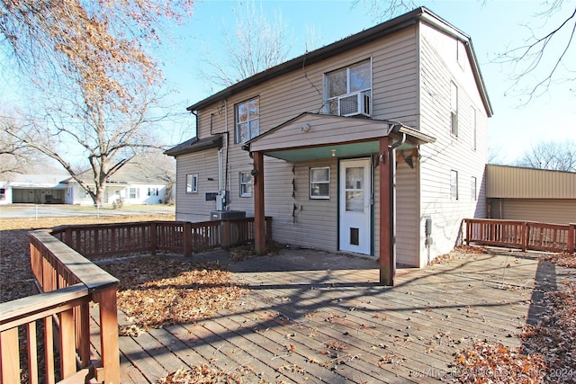 back of house with a wooden deck