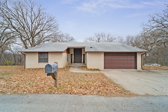 ranch-style home featuring a garage