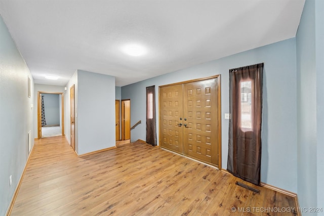 unfurnished bedroom with light hardwood / wood-style floors