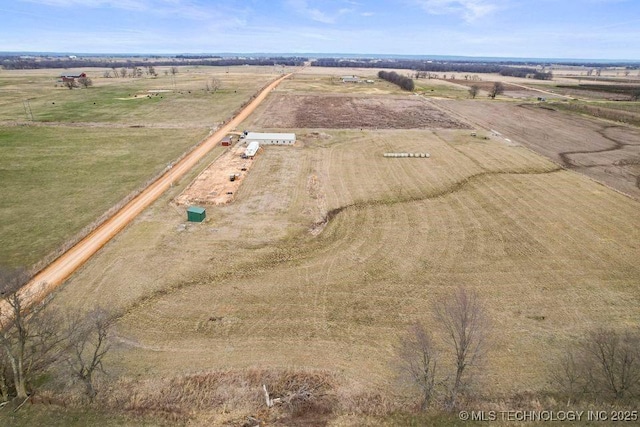 birds eye view of property featuring a rural view