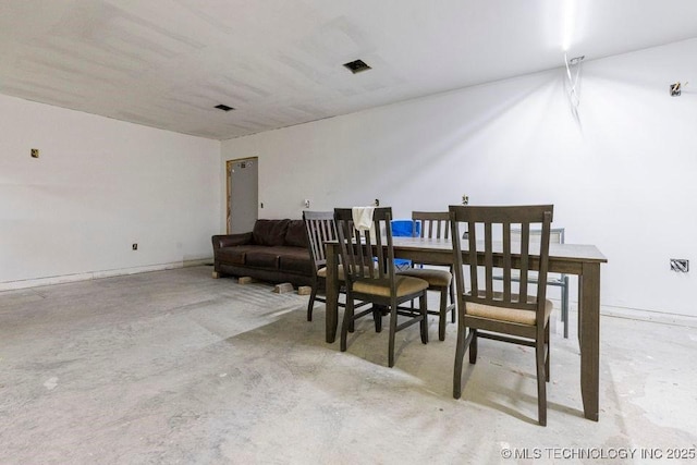 dining room with concrete floors and visible vents