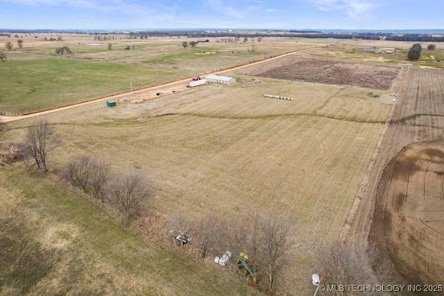 birds eye view of property featuring a rural view