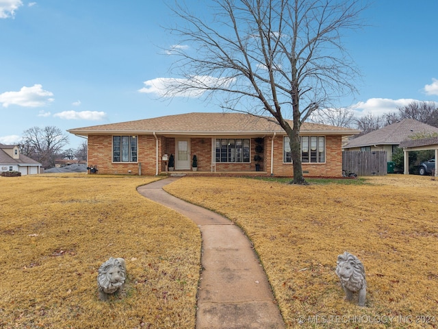 ranch-style house with a front yard