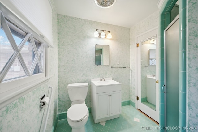 bathroom featuring tile patterned flooring, vanity, and an enclosed shower