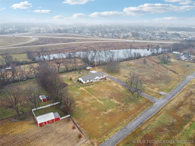 bird's eye view featuring a water view and a rural view