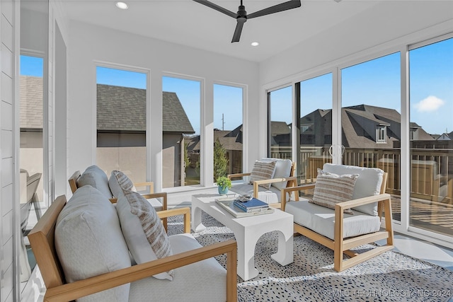 sunroom featuring ceiling fan