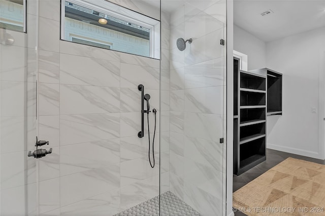 bathroom featuring tiled shower