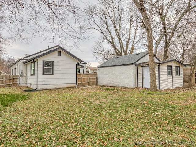 exterior space with a yard and an outdoor structure