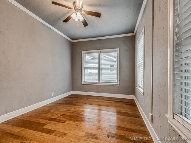 unfurnished room with ceiling fan, ornamental molding, a textured ceiling, and hardwood / wood-style flooring