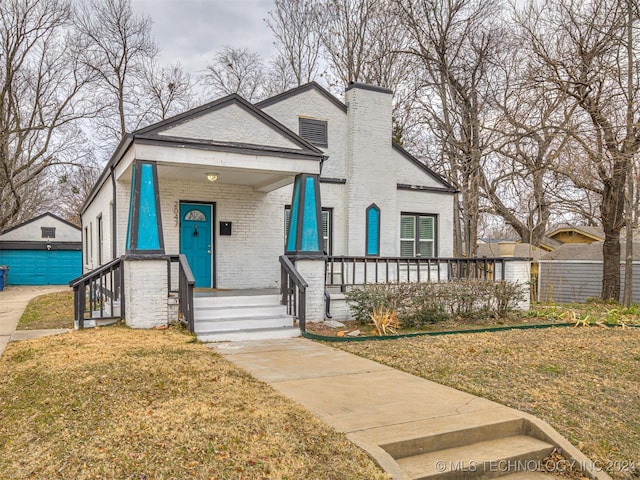 view of front facade with a porch and a front yard