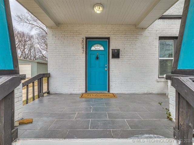 property entrance featuring covered porch